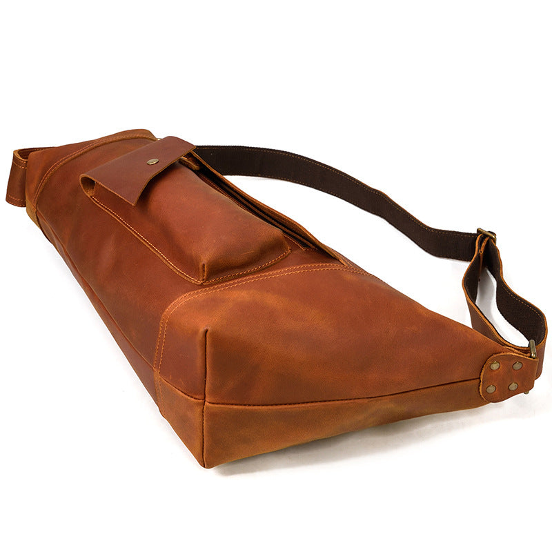 Front pocket detail of the Timber Carry Sling Bag, showing the easy-access storage for small travel essentials.