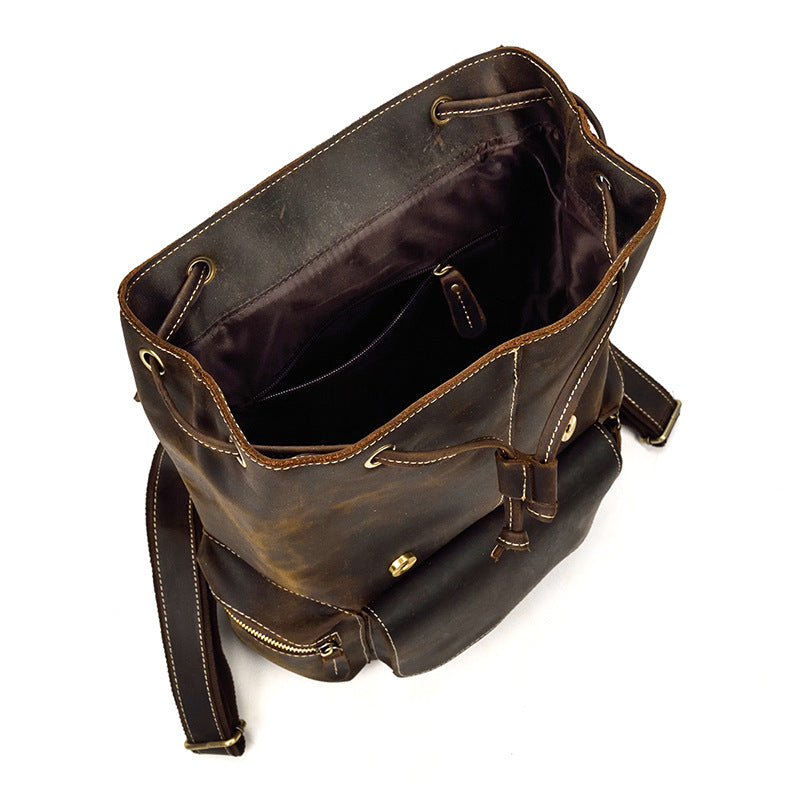 Brown leather bag with drawstring on a white background