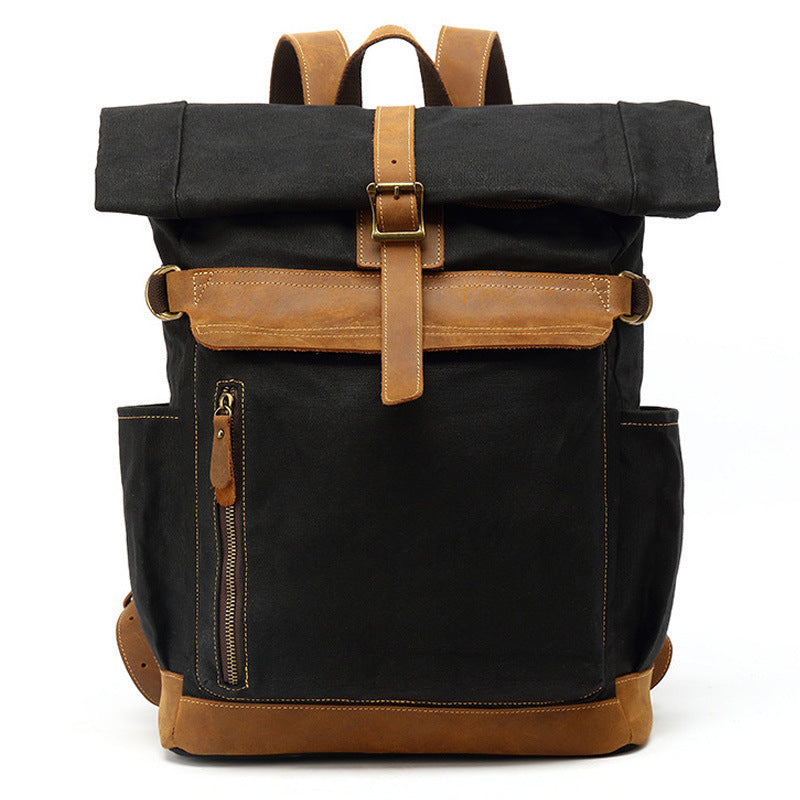 Sleek black waxed canvas rolltop backpack with vintage leather hardware