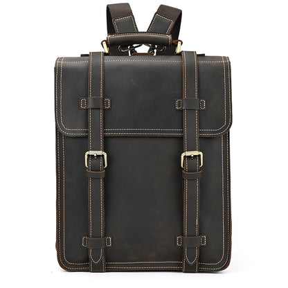 Dark Brown leather backpack with gold buckles on a white background