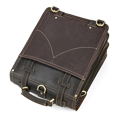 Dark Brown leather briefcase with gold accents on a white background