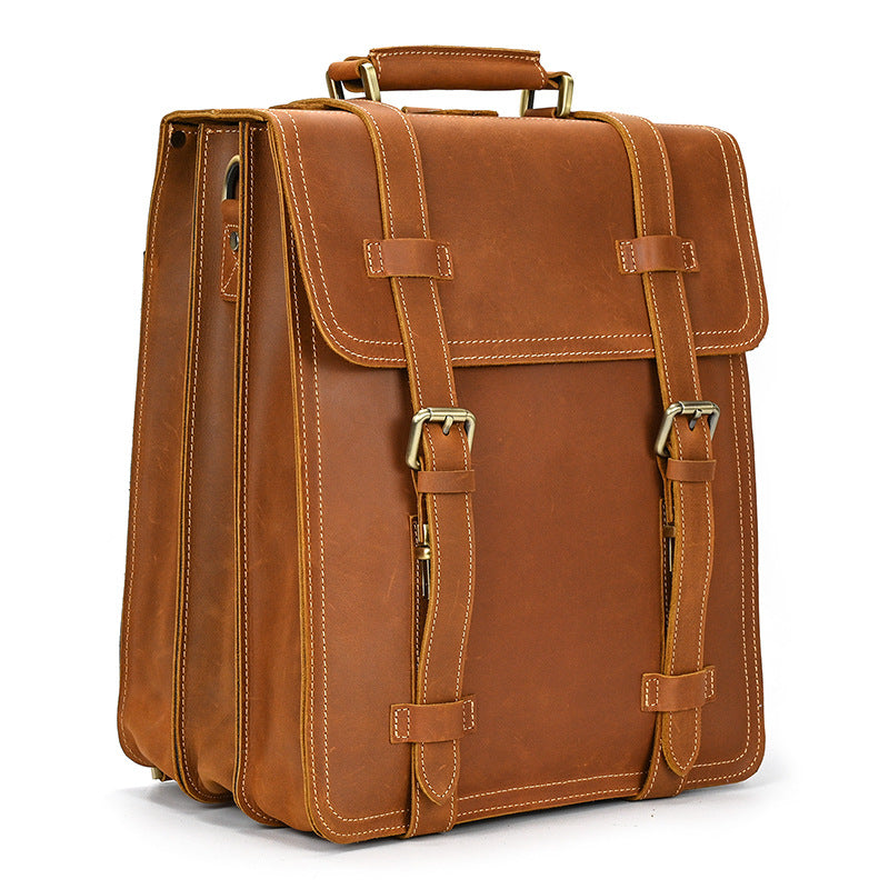 Brown leather satchel bag on a white background
