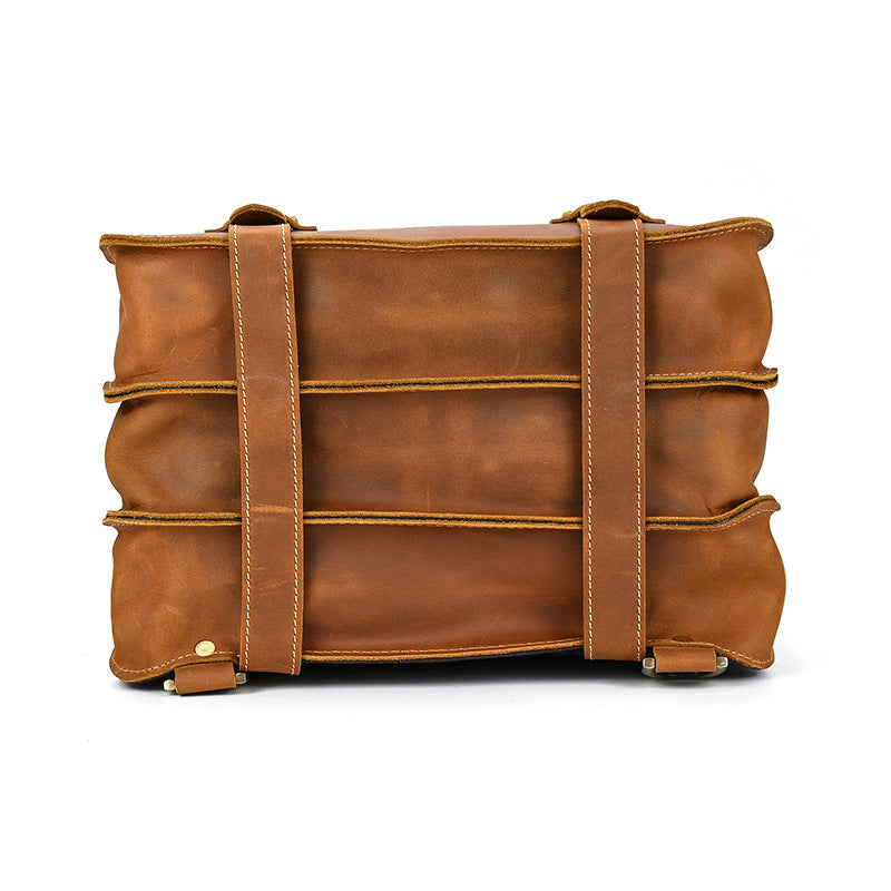 Brown leather bag with visible stitching on a white background