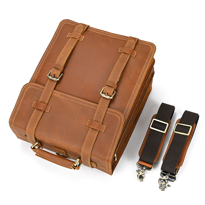 Brown leather bag with straps on a white background