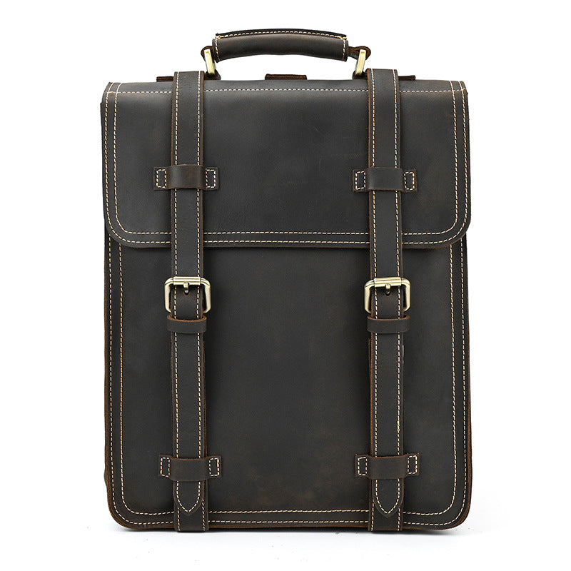 Dark Brown leather briefcase with gold buckles on a white background