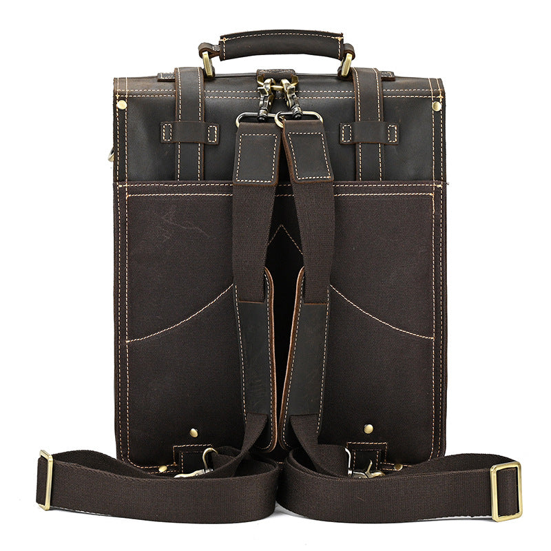Straps of Dark Brown leather briefcase with gold accents on a white background