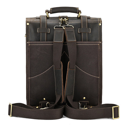 Straps of Dark Brown leather briefcase with gold accents on a white background