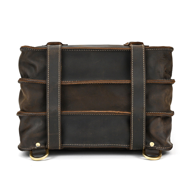 bottom view of Dark Brown leather bag with straps on a white background