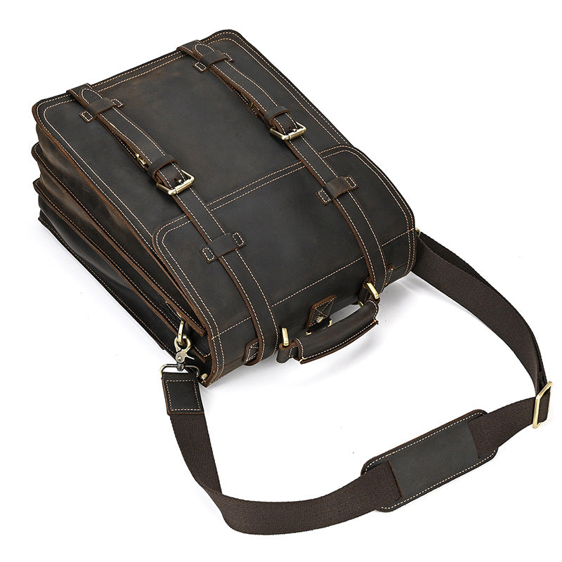 Dark Brown leather briefcase with shoulder strap on a white background