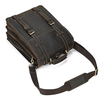 Dark Brown leather briefcase with shoulder strap on a white background
