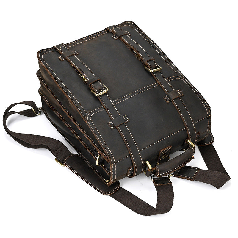 Dark Brown leather briefcase with gold buckles on a white background