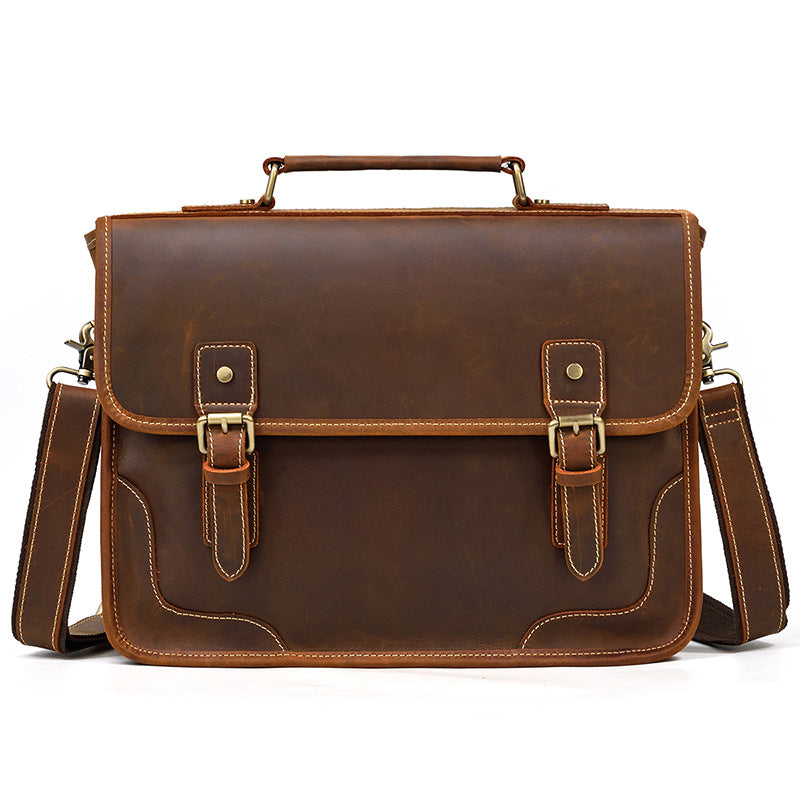 Front view of a Brown Crazy Horse Leather Briefcase with two decorative buckle straps and an executive minimal design.