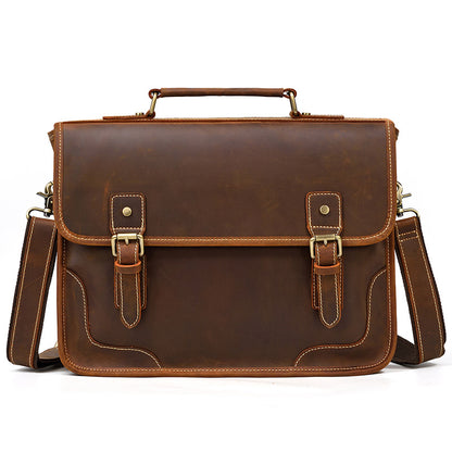 Front view of a Brown Crazy Horse Leather Briefcase with two decorative buckle straps and an executive minimal design.
