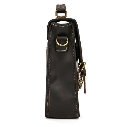 Dark brown leather wine bottle holder with gold accents on a white background