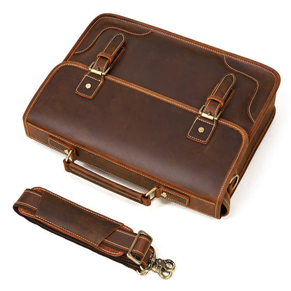 Top-down view of the Brown full-grain leather briefcase with the padded detachable shoulder strap.