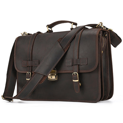 Vintage Crazy Horse leather briefcase with adjustable shoulder strap and brass hardware front view.