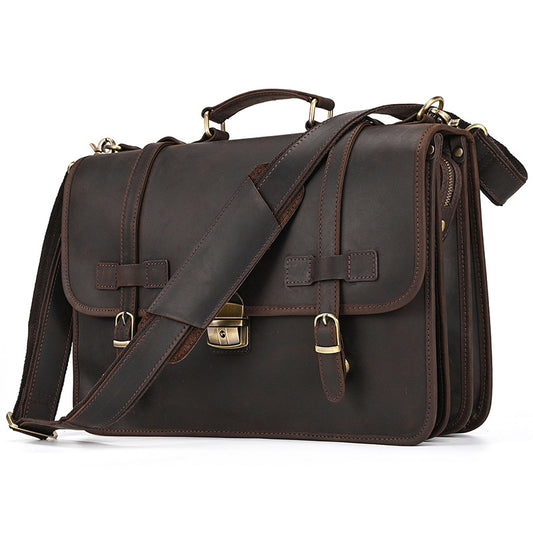 Vintage Crazy Horse leather briefcase with adjustable shoulder strap and brass hardware front view.