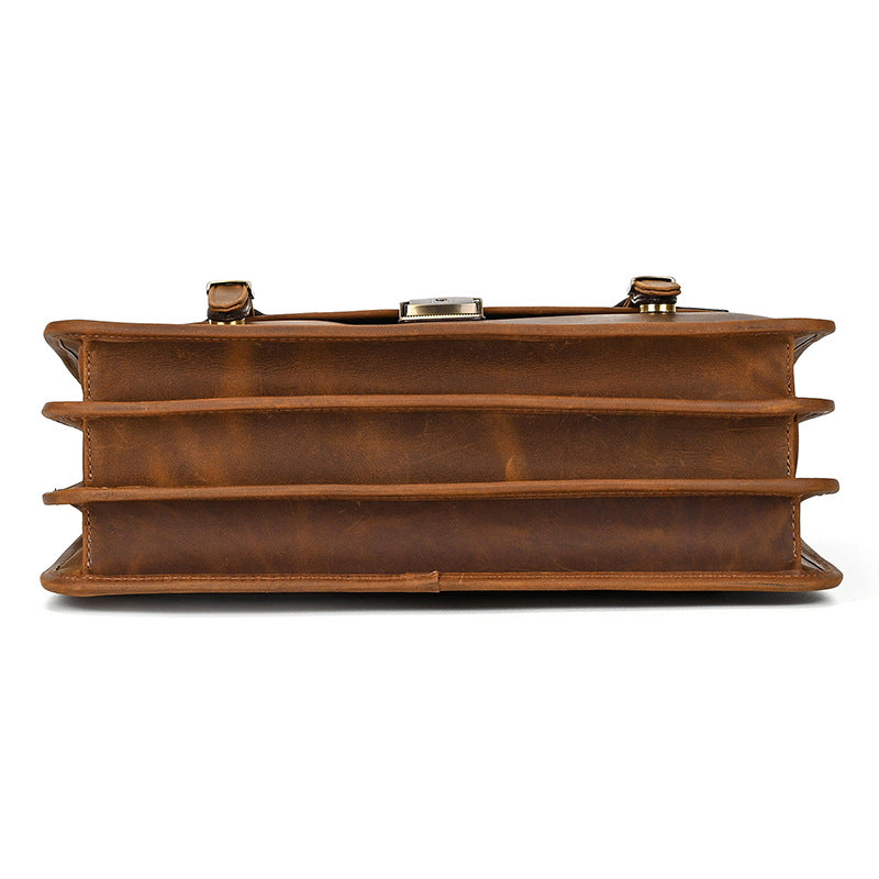 Bottom view of expandable light brown Crazy Horse leather briefcase with sturdy stitching.