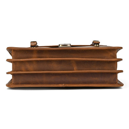 Bottom view of expandable light brown Crazy Horse leather briefcase with sturdy stitching.