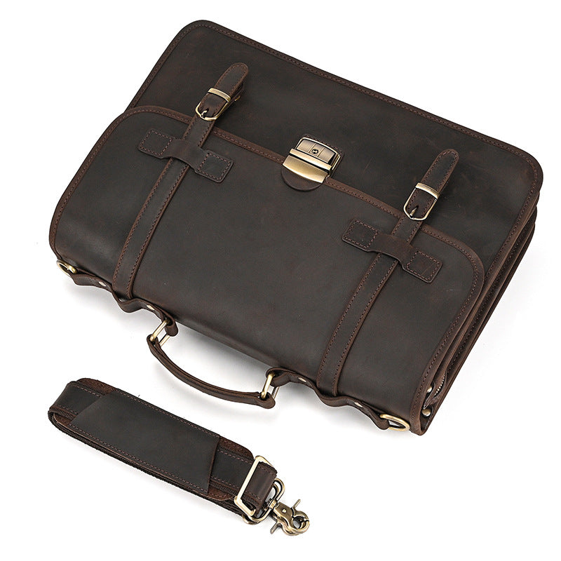 Top down view of minimalist Crazy Horse leather briefcase with detachable padded shoulder strap.