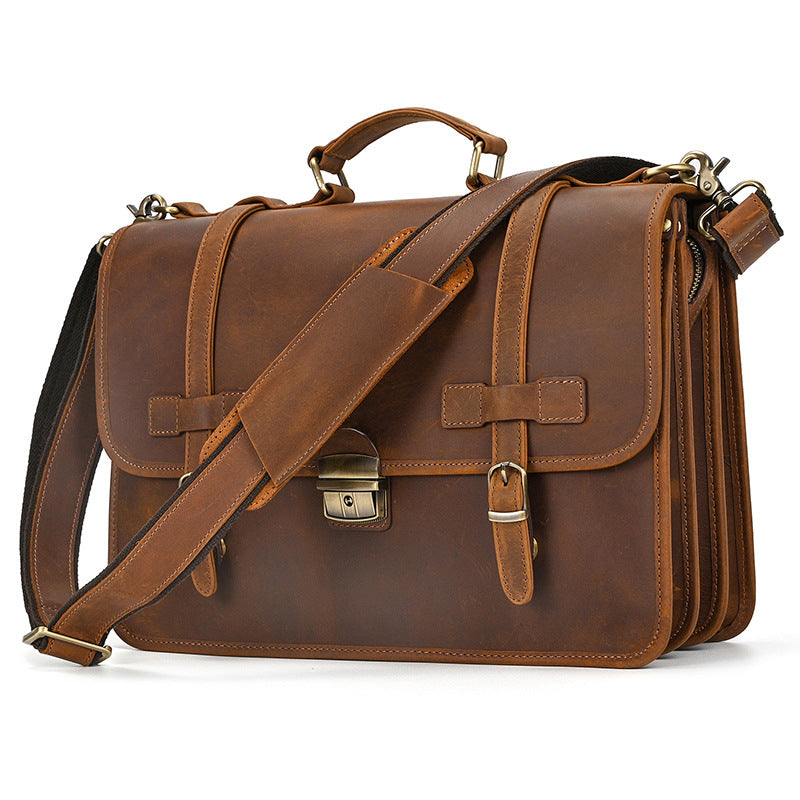 Light brown Crazy Horse leather briefcase with vintage crossbody strap front perspective.