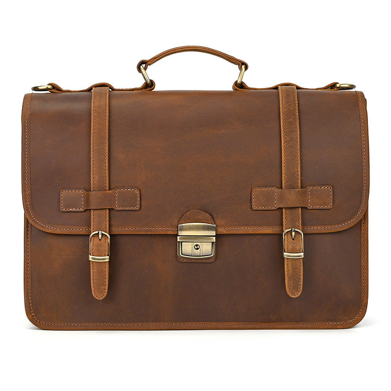 Front view of professional light brown leather business bag with brass push-clasp.