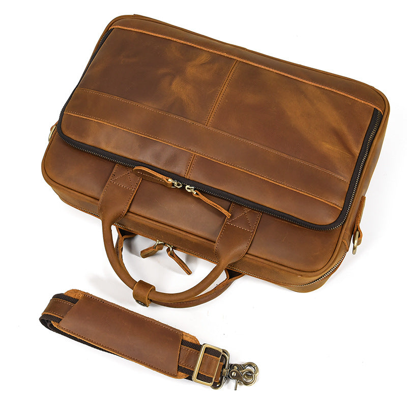 Angled top view of a Light Brown Crazy Horse Leather briefcase with a detachable and adjustable shoulder strap.