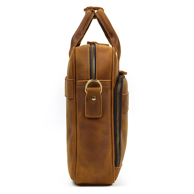 Side profile of the slim-designed Light Brown leather laptop bag showing the sturdy zipper and D-ring attachment.