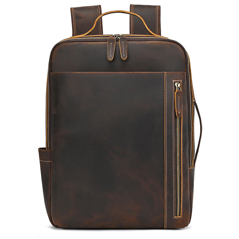 Vintage Brown leather backpack with gold zipper on a white background