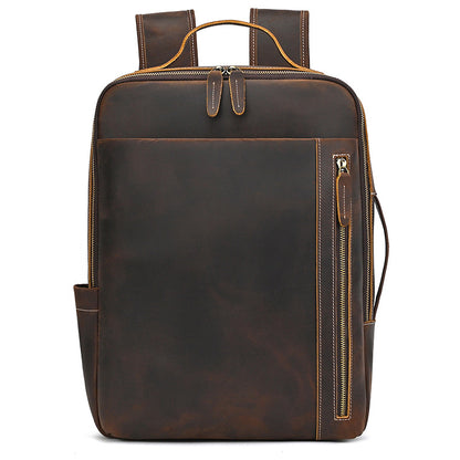 Vintage Brown leather backpack with gold zipper on a white background