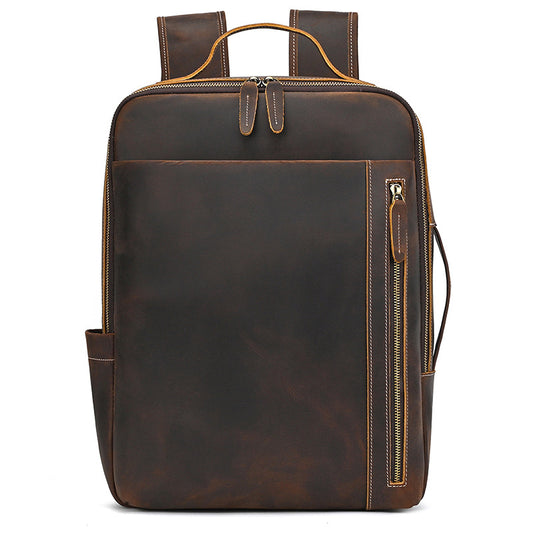 Vintage Brown leather backpack with gold zipper on a white background