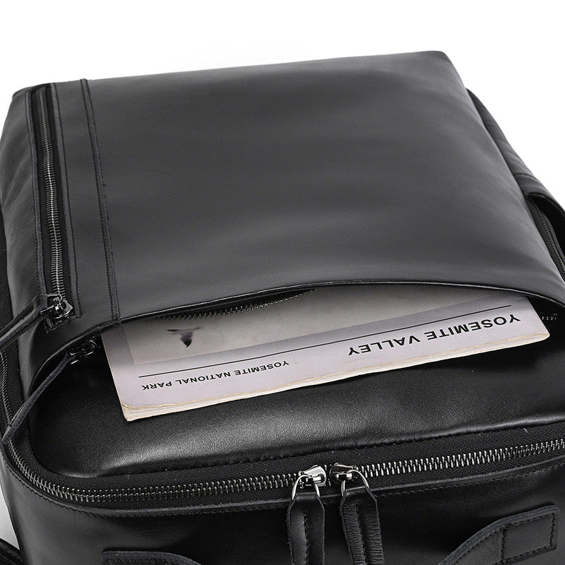 Classic Black backpack with a paper inside, showing the interior space.
