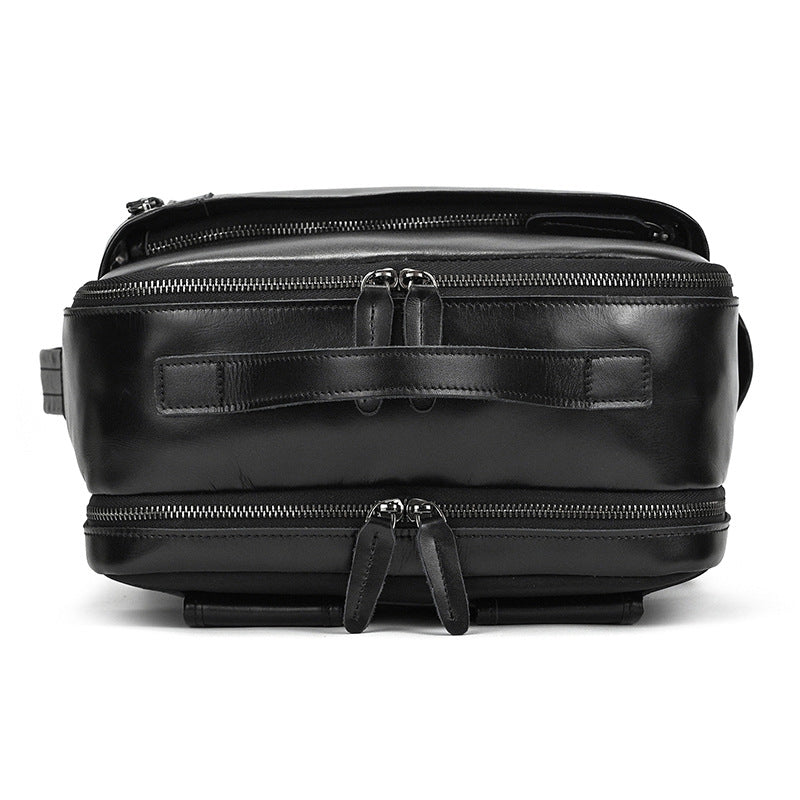 Top view of Classic Black leather bag with zippers on a white background