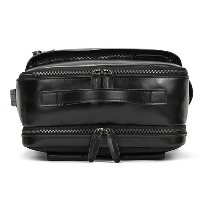 Top view of Classic Black leather bag with zippers on a white background
