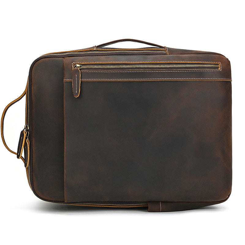 Vintage Brown leather briefcase with gold zipper on a white background
