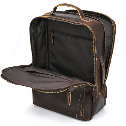 Vintage Brown leather backpack with open front compartment on a white background