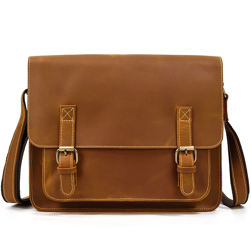 Brown leather satchel bag on a white background