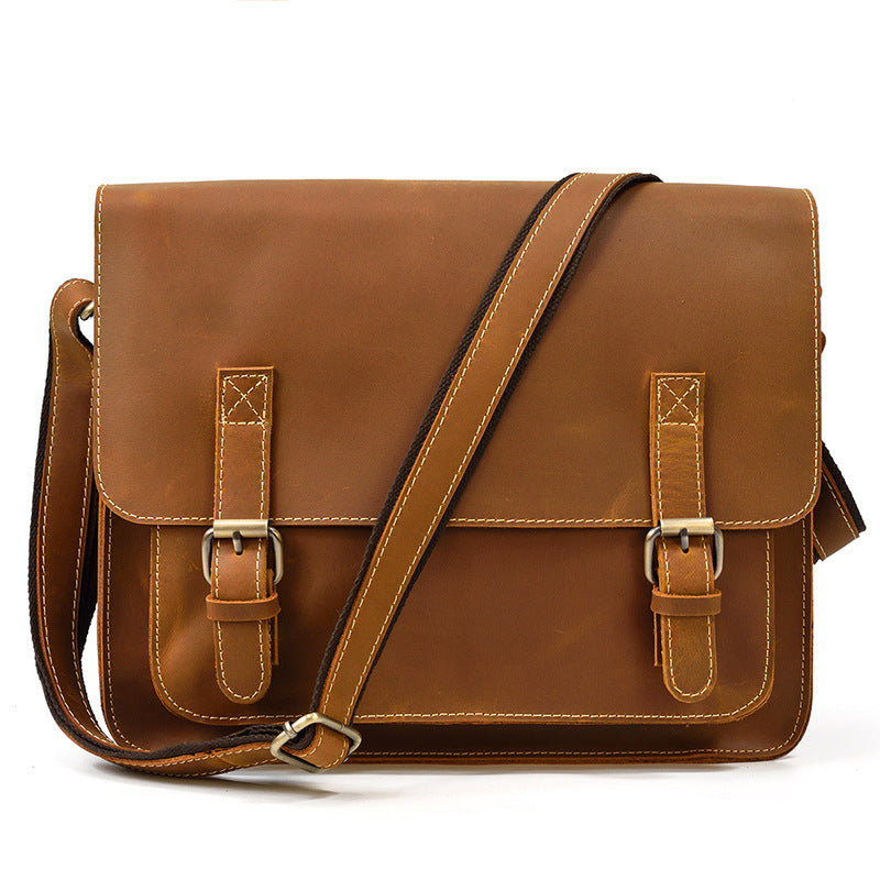 vintage leather messenger bag with adjustable shoulder strap front angle