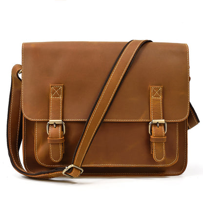 vintage leather messenger bag with adjustable shoulder strap front angle