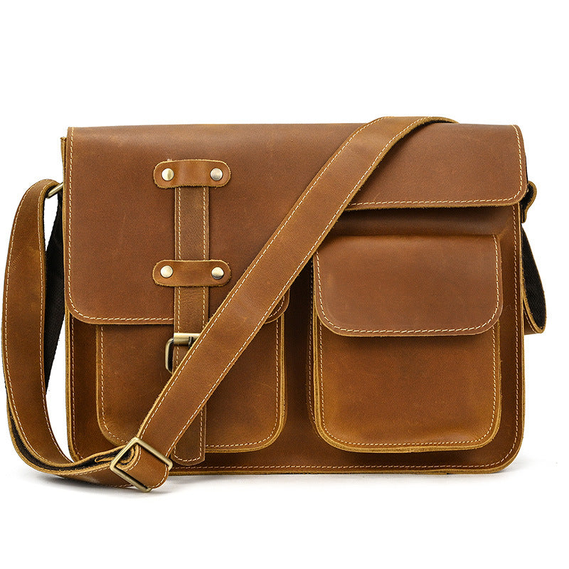 Brown leather satchel bag on a white background