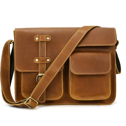 Brown leather satchel bag on a white background