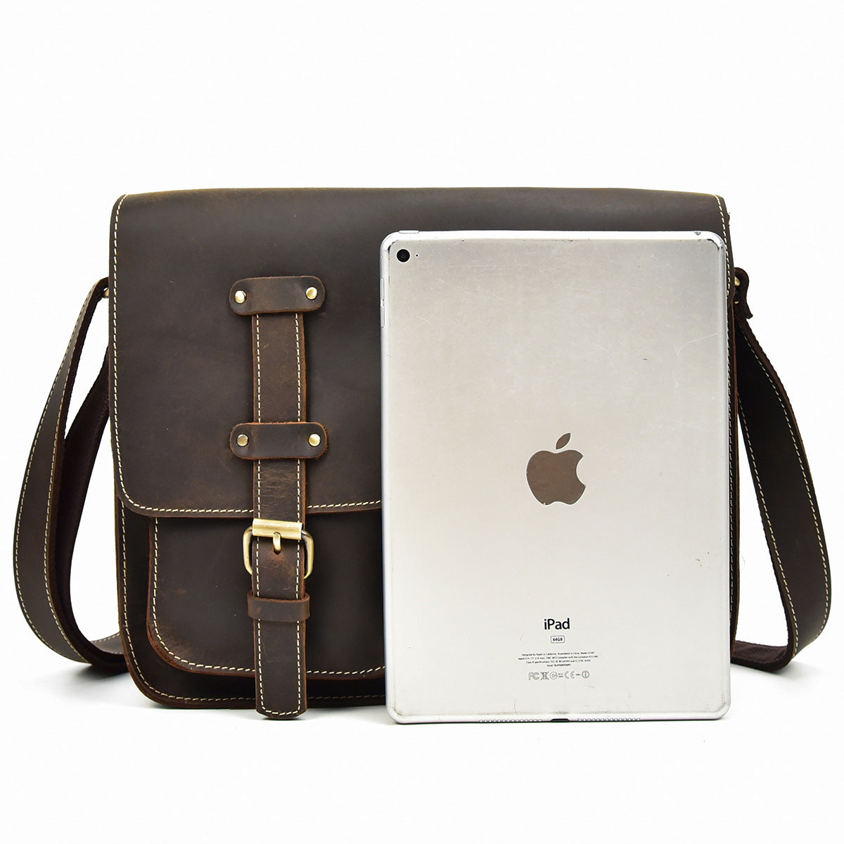 Brown leather bag with a silver Apple iPad on a white background
