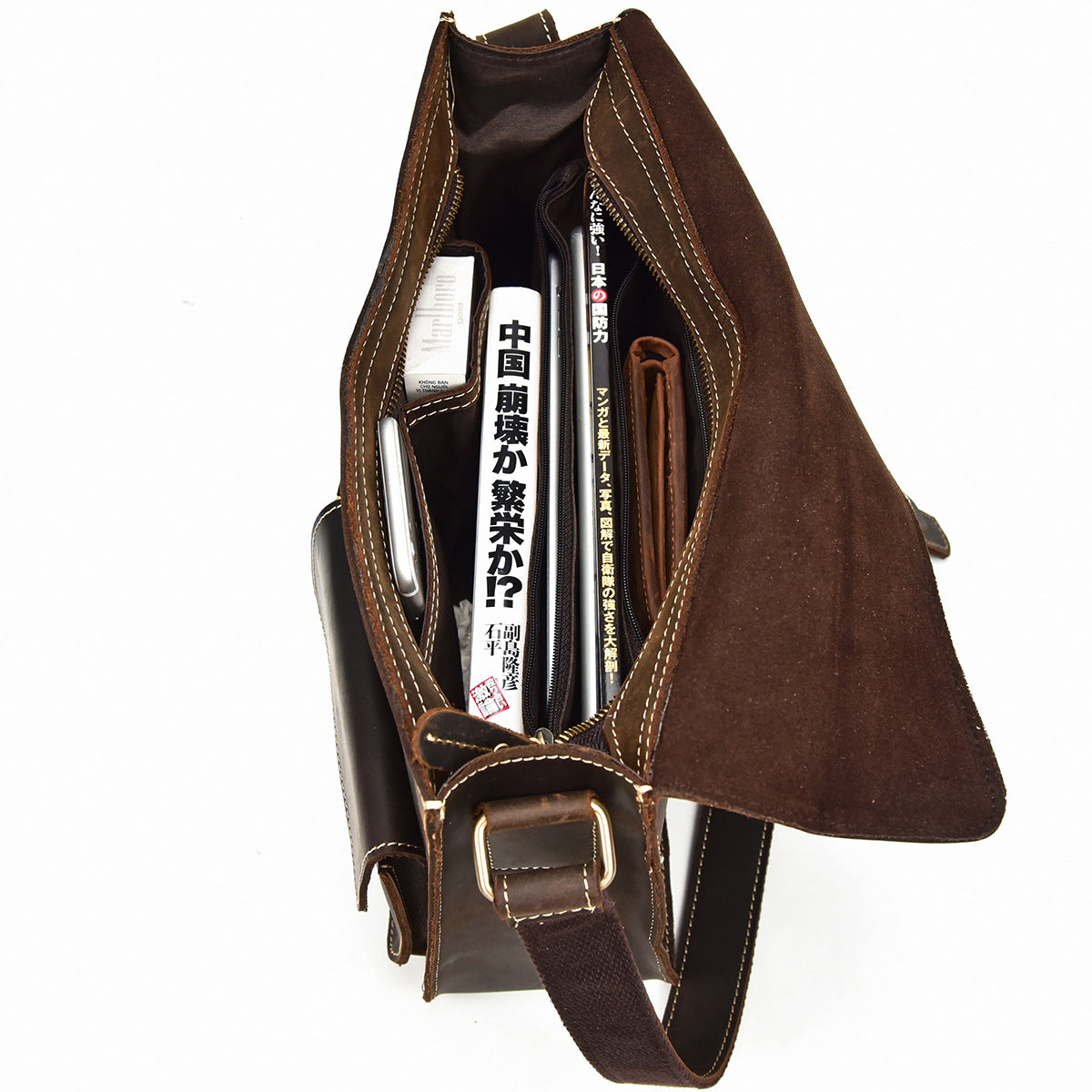 Brown leather bag with a strap on a white background