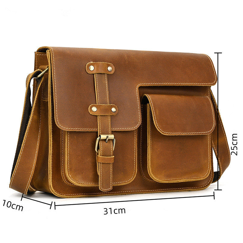 Brown leather satchel bag with measurements on a white background
