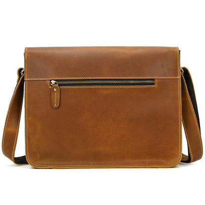 back view of Brown leather crossbody bag with a pocket on a white background