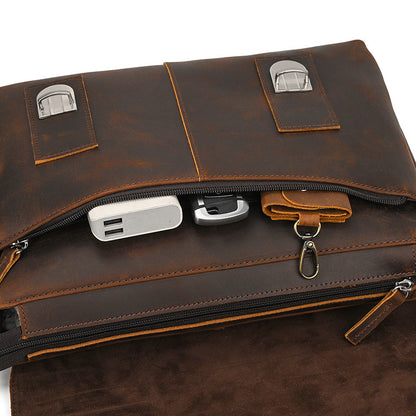 Brown leather briefcase with USB port and zipper on a white background