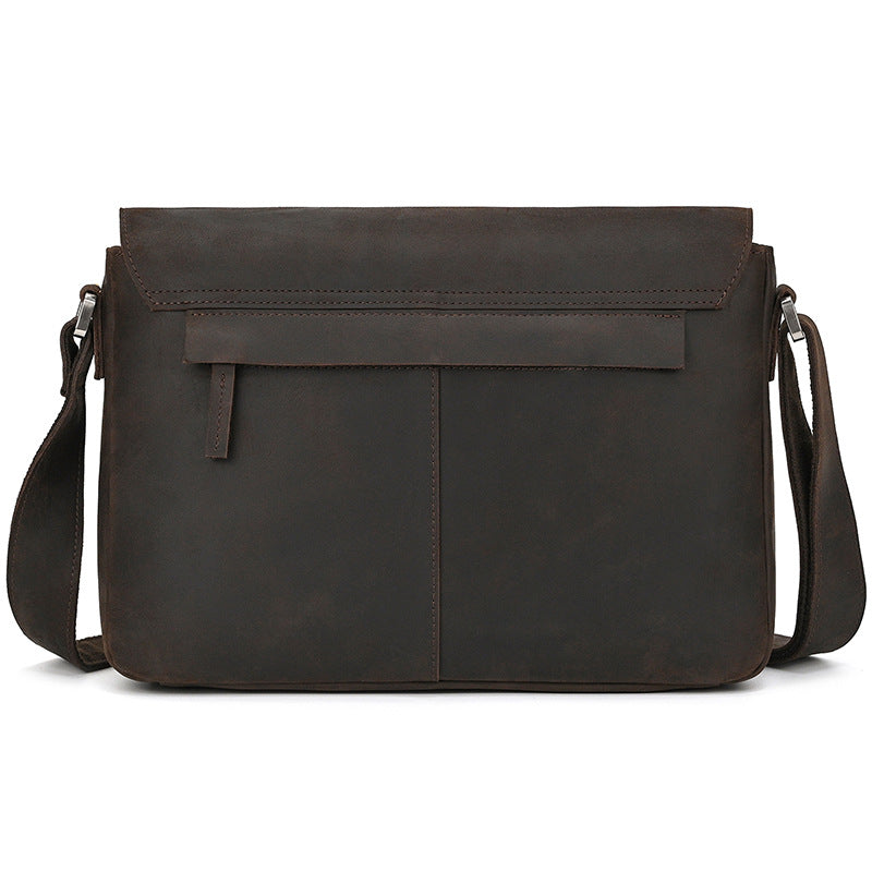 Brown leather messenger bag on a white background