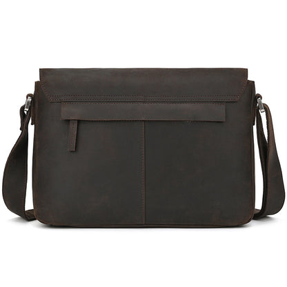 Brown leather messenger bag on a white background