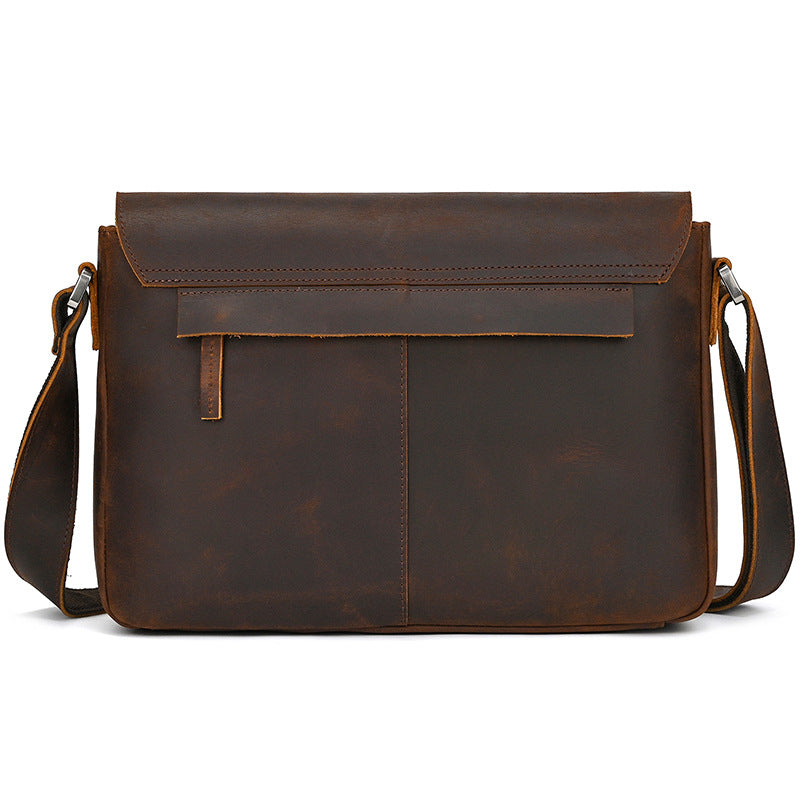 Brown leather messenger bag on a white background