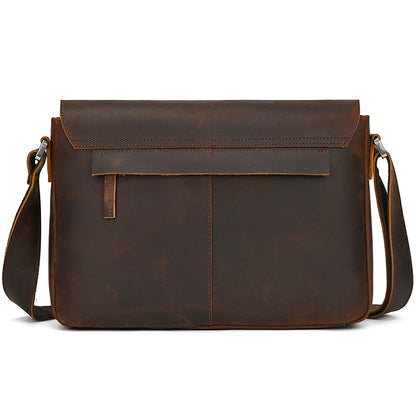 Brown leather messenger bag on a white background